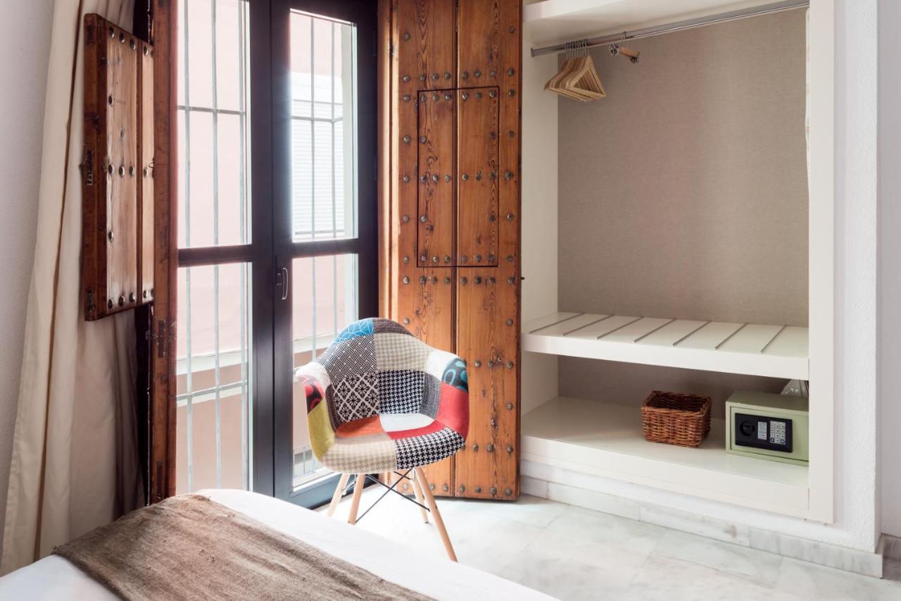Apartamentos La Casa Del Pozo Santo Sevilla Bagian luar foto