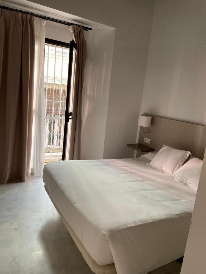 Apartamentos La Casa Del Pozo Santo Sevilla Bagian luar foto