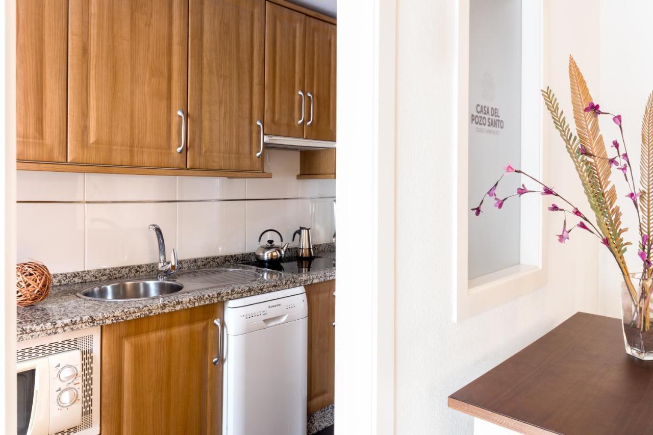 Apartamentos La Casa Del Pozo Santo Sevilla Bagian luar foto