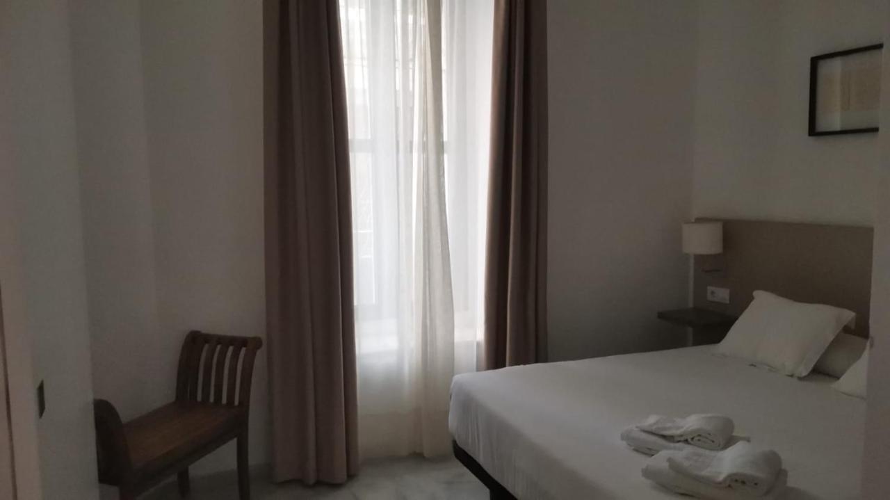 Apartamentos La Casa Del Pozo Santo Sevilla Bagian luar foto